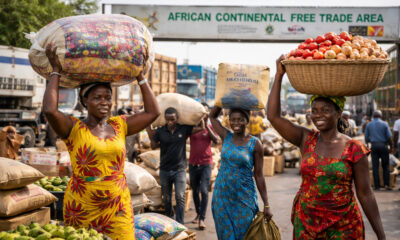 African women and youth traders transporting goods across a border, symbolizing informal cross-border trade and the role of the AfCFTA in Africa’s economic integration.