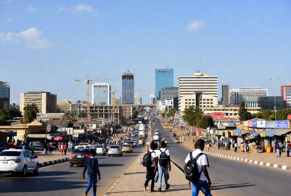 Bustling African street, construction sites, and young people - representing rapid urbanization driving economic growth across the continent.