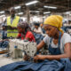 Factory workers in Africa highlighting the productivity and infrastructure challenges behind the “cheap labor” myth in manufacturing.