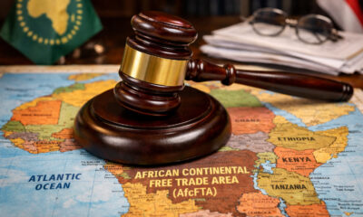 A gavel rests on a map of Africa, symbolizing the debate over legal enforcement for the AfCFTA single market.