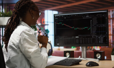 African Business strategist analyzing Africa investment plans based on new rankings.