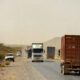 Trucks on an African road illustrating challenges in continental trade integration and economic unity