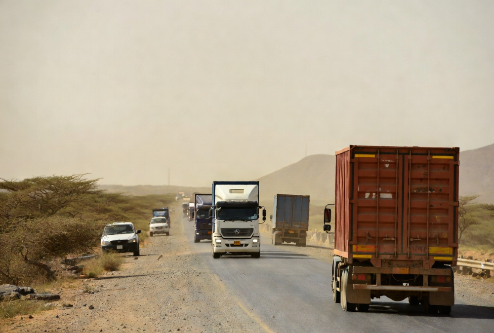 Trucks on an African road illustrating challenges in continental trade integration and economic unity