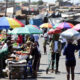 Informal traders and small businesses operating in township markets in South Africa, illustrating the country’s large informal economy behind falling unemployment figures.
