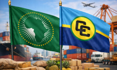 African Union and CARICOM flags representing growing trade partnership and export opportunities valued at $1.6 billion between Africa and the Caribbean.