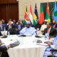African leaders and international diplomats gathered at a summit table, representing the continent's growing role in middle power mediation and conflict resolution