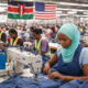 Factory workers producing apparel for export under AGOA in Kenya, highlighting reliance on duty-free access to the United States market amid comparisons with industrial growth in Bangladesh.