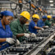 African manufacturing facilities with workers on production lines representing industrial growth across Egypt, Nigeria, and South Africa