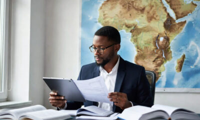 Exporter reviewing market data and regulations across multiple African countries, highlighting the importance of due diligence, trade compliance, and country-specific export strategies in Africa