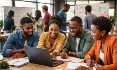African entrepreneurs collaborating in a startup studio, turning innovative ideas into scalable businesses with support from venture builders and universities.