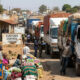 African border crossing with trucks and traders highlighting customs delays and the need for improved trade facilitation and infrastructure systems