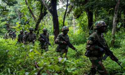 Rwandan soldiers on patrol in Cabo Delgado, Mozambique, supporting counterterrorism operations against Islamist insurgents in northern Mozambique.