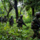 Rwandan soldiers on patrol in Cabo Delgado, Mozambique, supporting counterterrorism operations against Islamist insurgents in northern Mozambique.