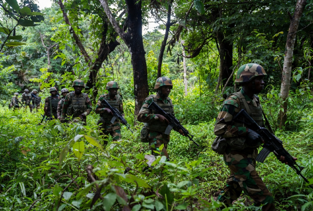 Rwandan soldiers on patrol in Cabo Delgado, Mozambique, supporting counterterrorism operations against Islamist insurgents in northern Mozambique.
