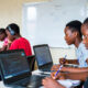 African youth learning coding and STEM skills in classroom