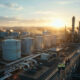 African oil refinery facility with storage tanks representing energy sovereignty and fuel circulation systems