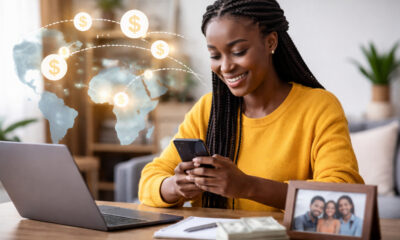 African diaspora professional sending mobile remittance transfer to family back home in Africa