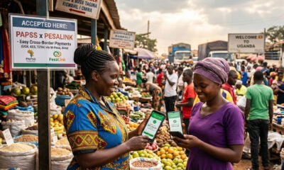 African woman trader using mobile payment for cross-border commerce via PAPSS-PesaLink integration