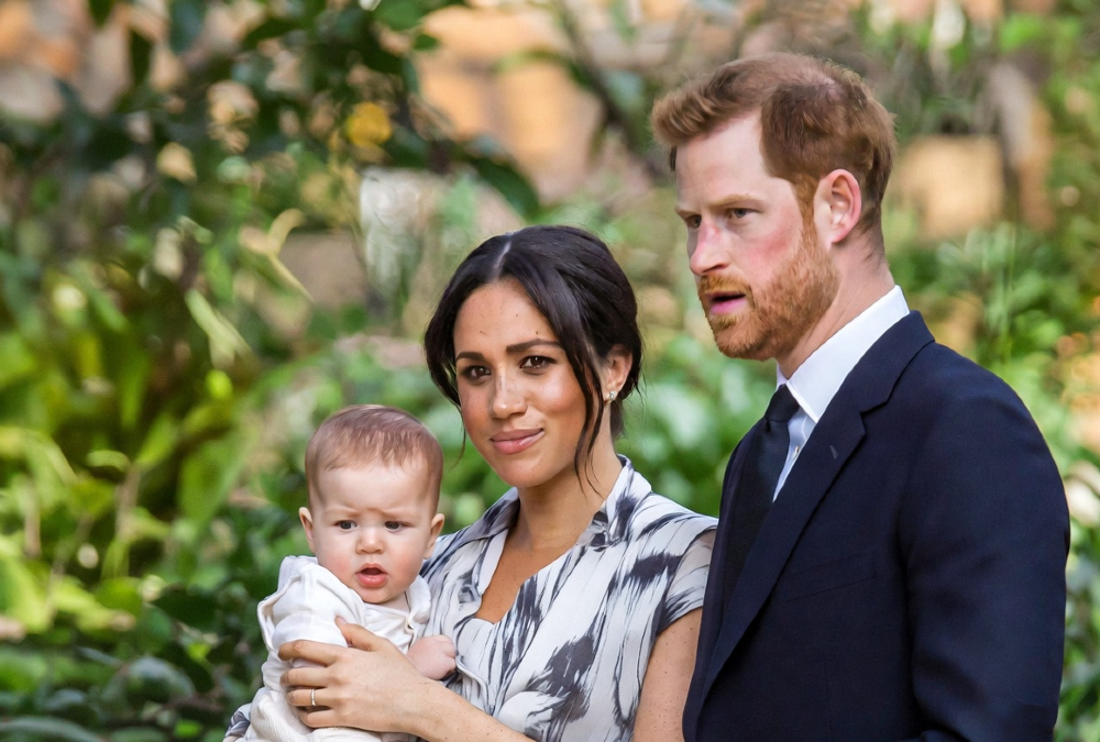 Meghan Markle and Prince Harry with son Archie, sparking royal family discussions about race and skin tone