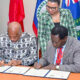 UWI Vice-Chancellor Hilary Beckles and CVNU Secretary General Andrew Haruna signing MoU at UWI Regional Headquarters in Jamaica