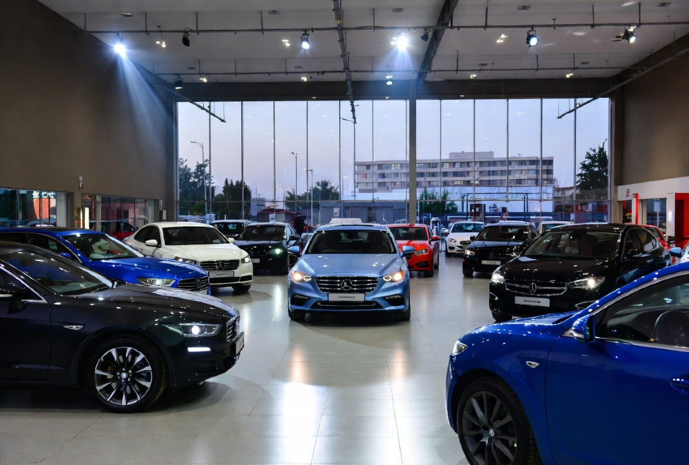 Modern car dealership showroom in Lagos, Nairobi, or Johannesburg reflecting brand-consistent customer experience
