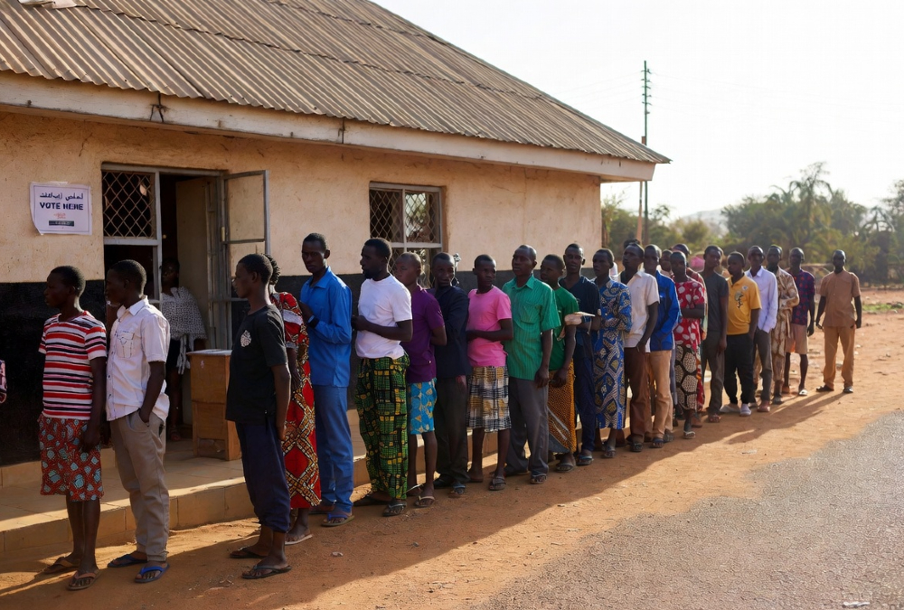 African citizens voting in an election, highlighting the democracy trap where ballots exist but real political and economic power remains limited.