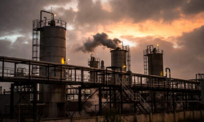 An industrial processing facility at dusk, symbolizing the need for reliable and stable energy to power Africa's manufacturing sector and agro-industrial clusters.