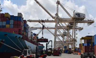Tunisian port workers loading export cargo ships bound for European Union markets under Euro-Mediterranean trade agreements