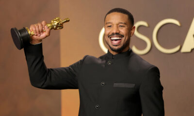 Michael B. Jordan holding his 2026 Best Actor Oscar for Sinners at the Academy Awards, making history as the sixth Black actor to win the award.