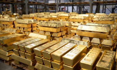 Gold bars representing South Africa's five trillion dollar gold export legacy shipped to European and American markets