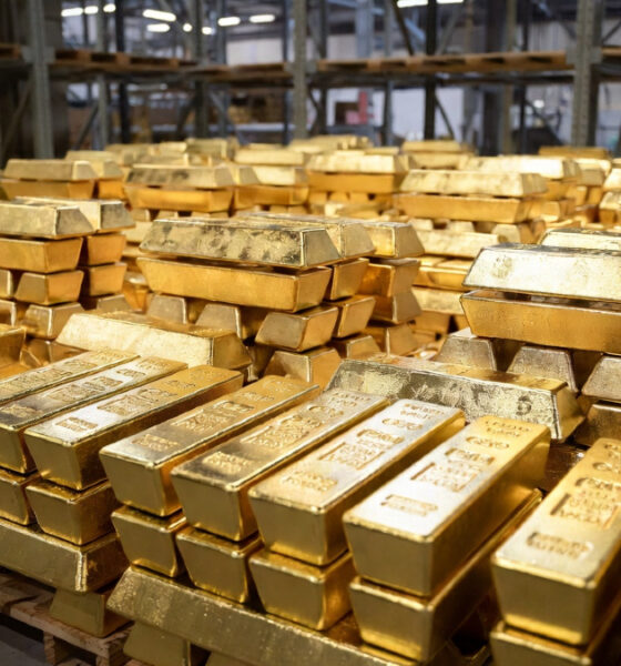 Gold bars representing South Africa's five trillion dollar gold export legacy shipped to European and American markets
