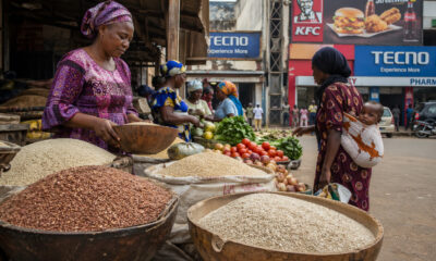 Modern African market scene with fresh traditional foods like millet, sorghum, and vegetables, symbolizing healthy local diets contrasted with urban processed food culture and the impact of Western development on public health