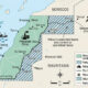 Western Sahara conflict map showing Moroccan-controlled territory, Polisario Front areas, refugee camps in Tindouf, and key resources like phosphate mines and Atlantic fishing zones