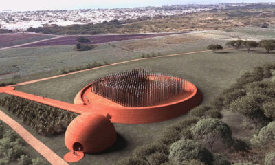 Rendering of the Barbados slavery memorial designed by Adjaye Associates, featuring teak wooden stakes sourced from Ghana as a symbolic landscape intervention.