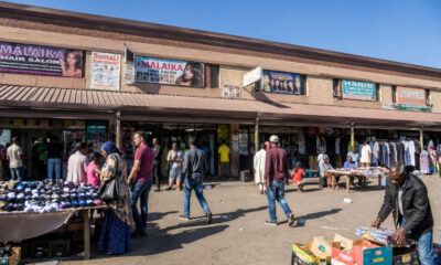 South African township street market with African migrant traders and vendors