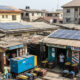 Nigeria's parallel electricity economy with generators and solar panels replacing collapsed national grid infrastructure