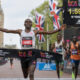 Sebastian Sawe crossing the finish line at the London Marathon, breaking the sub-two-hour marathon record with a historic 1:59:30 performance amid cheering crowds.