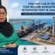 Tanzanian President Samia Suluhu Hassan with image of Construction of the $300 million Mangapwani Integrated Port in Zanzibar, Tanzania, showing a modern deep-water mega-port with container ships, cranes, and an adjacent power plant under development