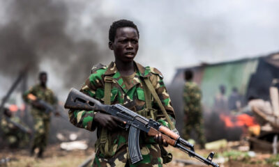 Child soldier in eastern DR Congo armed conflict, highlighting the ongoing child recruitment crisis in Central Africa.