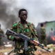Child soldier in eastern DR Congo armed conflict, highlighting the ongoing child recruitment crisis in Central Africa.