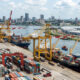 Container ships at Abidjan port with cranes loading goods, symbolizing West Africa's shift from consumer frontier to production and logistics hub - challenging outdated "One Africa market" assumptions.