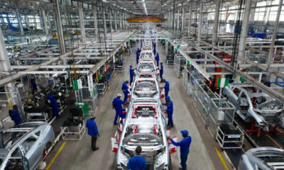 Modern passenger vehicle assembly line at an automotive plant in Africa, showcasing industrial growth and manufacturing innovation.
