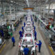 Modern passenger vehicle assembly line at an automotive plant in Africa, showcasing industrial growth and manufacturing innovation.