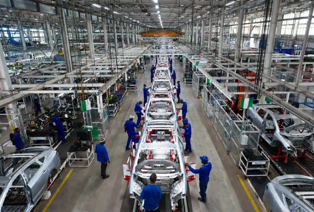 Modern passenger vehicle assembly line at an automotive plant in Africa, showcasing industrial growth and manufacturing innovation.