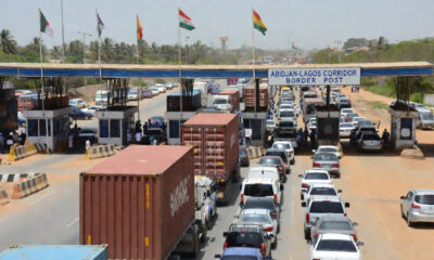 Vehicles on the Abidjan-Lagos corridor waiting at a border checkpoint, illustrating Africa corridor governance challenges and the need for shared ownership and logistics performance metrics.