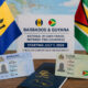 Barbadian and Guyanese national ID cards on a map of the Caribbean, symbolizing passport-free travel between the two countries starting July 1, 2026