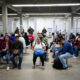 Migrants awaiting deportation processing under US third-country removal agreements with minimal notice.