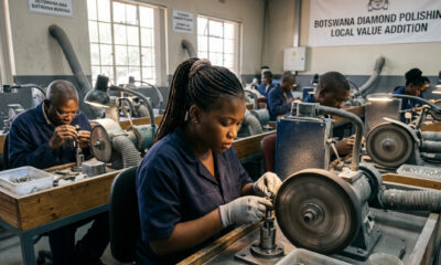 Artisans polishing diamonds in Botswana, showcasing the country's economic strategy to capture local value.