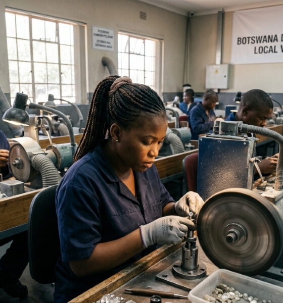 Artisans polishing diamonds in Botswana, showcasing the country's economic strategy to capture local value.