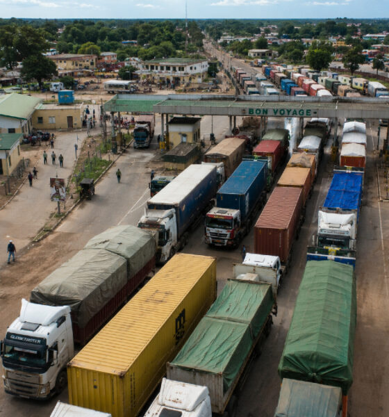 Aerial view of a busy African border crossing with trucks queued for customs clearance, illustrating the trade facilitation challenges facing intra-African commerce.